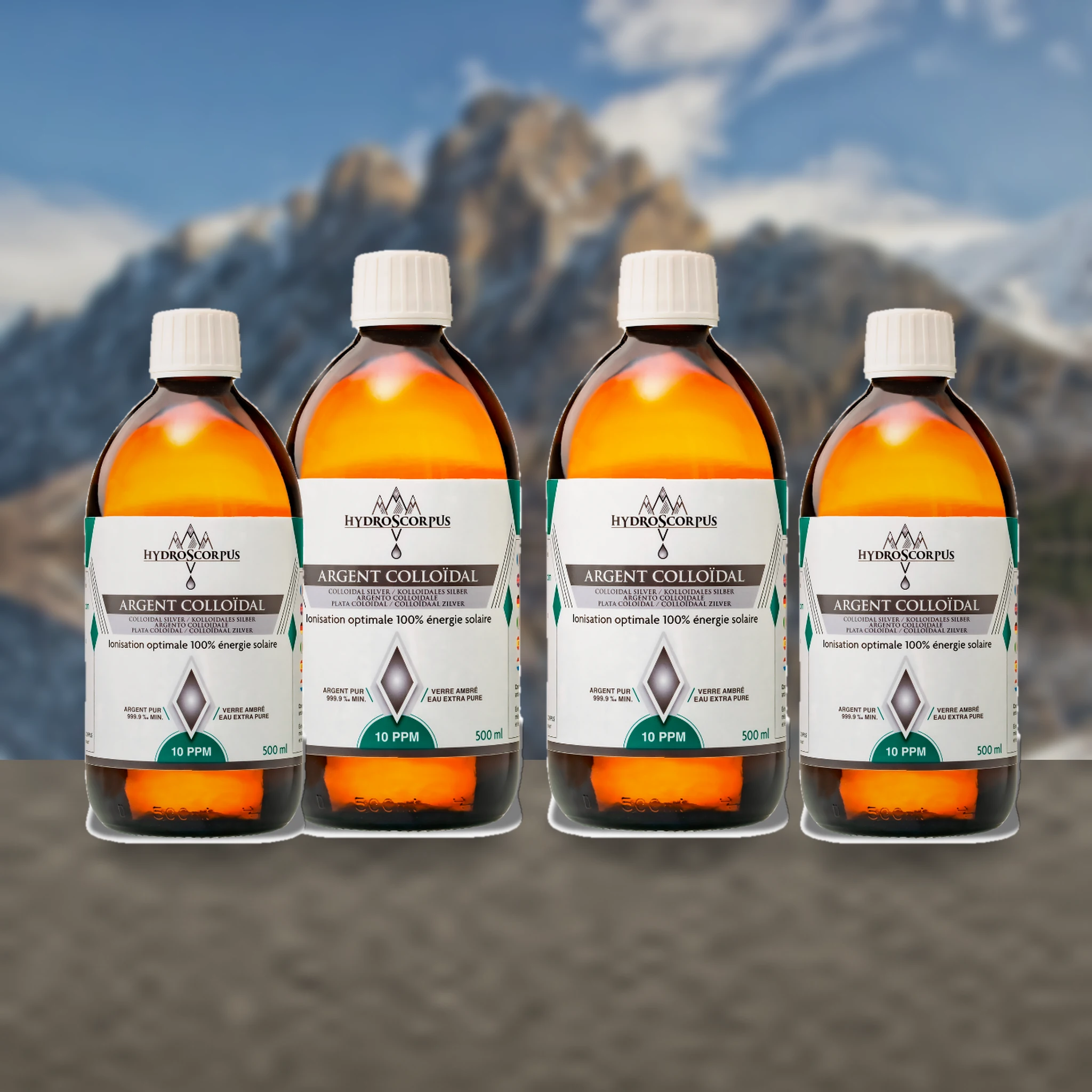Lot de 4 bouteilles d’argent colloïdal Hydroscorpus 10 PPM en verre ambré 500 ml en vue alternative.